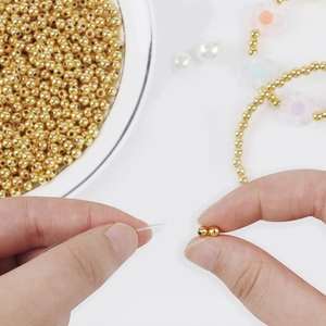Macro shot of 14K gold-plated spacer beads used for handmade DIY jewelry crafting