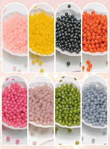 Detailed view of 8mm translucent DIY beads in eight vibrant colors for jewelry making