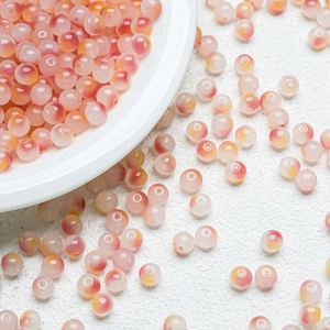 Macro detail of 8mm gradient jelly glass beads for DIY jewelry making and handcrafting