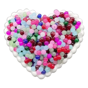 Multi-colored 8mm translucent beads in heart-shaped dish for DIY jewelry making