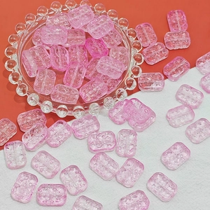 Macro detail of 13x18mm pink translucent glass flower beads with textured surface for DIY jewelry