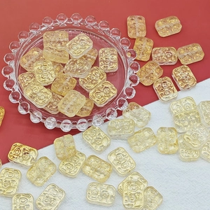 Detail of 13x18mm double-sided glass flower beads with gold foil relief for DIY jewelry
