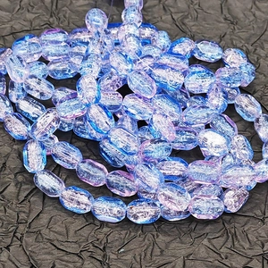 Close-up of 6x10mm ice-cracked rectangle glass beads with blue purple gradient