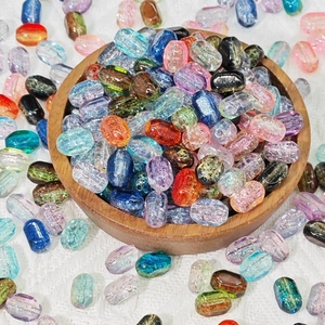 Macro shot of 6x10mm mixed rectangle glass beads with gold foil foil texture for DIY jewelry