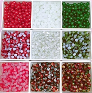 Macro view of assorted 8/10mm colorful Christmas glass beads in a white organizer box