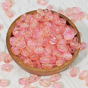 Macro detail of rectangle pink glass beads with ice crackle texture for DIY jewelry
