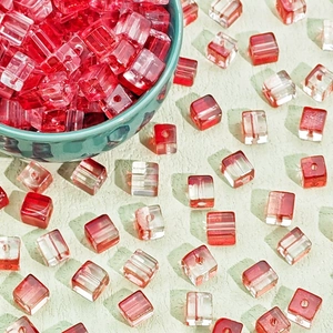 Macro detail of red square glass beads for Christmas DIY bracelets and jewelry making