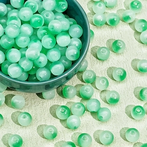 Detail of 8/10mm translucent green glass beads for DIY jewelry and necklaces