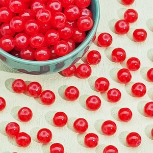 Macro shot of 10mm bright red crackle glass beads with center holes for DIY jewelry