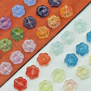 Vue détaillée de perles tournesol en verre 14mm aux couleurs vives pour bijoux DIY