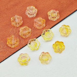 Vue détaillée de perle de fleur de soleil en verre orange 14mm pour bijoux DIY