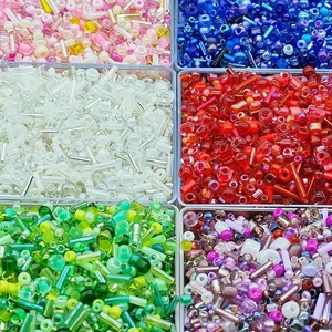 Colorful DIY glass seed beads and bugle beads kit organized in a clear plastic storage box