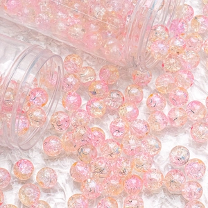 Macro shot of 10mm pink cracked glass beads with ice texture for DIY jewelry making