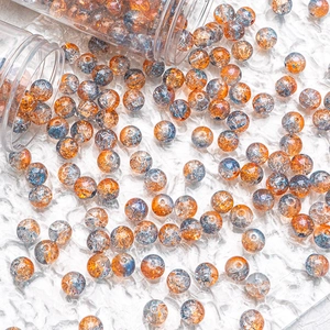 Close-up of 10mm orange and blue crackled glass beads for DIY jewelry making