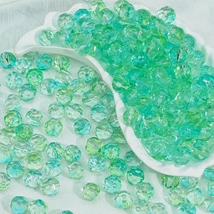 Macro shot of 10mm faceted transparent glass beads for DIY jewelry making and crafts