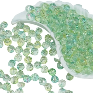 Faceted 10mm light green glass beads for DIY jewelry making in a crescent tray