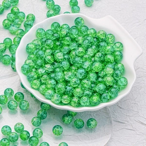 Green 10mm cracked glass round beads for DIY jewelry making in a white shell bowl
