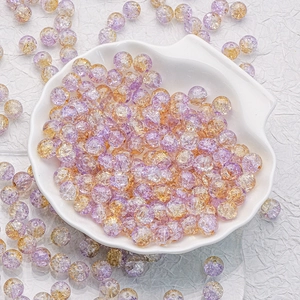 Detail of 10mm cracked glass beads in purple and orange for DIY jewelry making