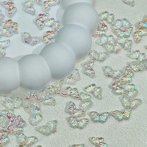 Macro view of crystal aurora butterfly beads for DIY jewelry and hair accessories