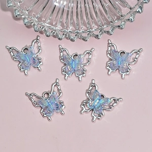 Cinq breloques papillon aurore avec cadres en argent pour la création de bijoux DIY créatifs