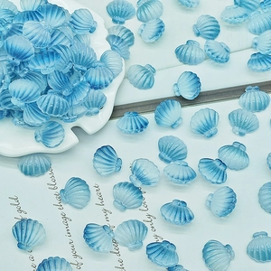 Macro detail of blue gradient translucent shell beads for DIY jewelry and nail art crafts