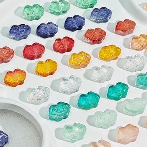 Macro detail of colorful glazed cloud beads with auspicious pattern for DIY jewelry