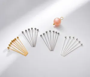 Macro view of 14k gold plated ball pins in gold and silver for DIY jewelry making