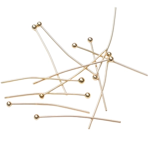 14k gold plated ball head pins for jewelry making shown in a scattered bulk arrangement