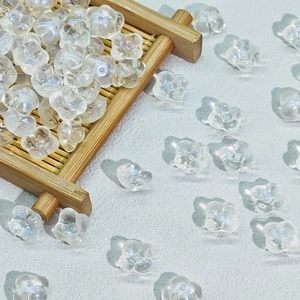 Macro shot of 10mm transparent flower-shaped glass beads for DIY jewelry making