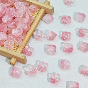 Macro shot of 10mm light pink translucent glass flower beads for DIY jewelry making