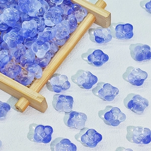 Close-up of translucent purple flower beads for DIY jewelry with clear petal textures