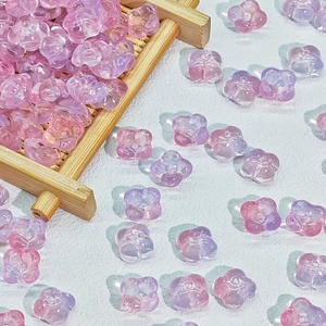 Macro shot of 10mm gradient glass flower beads for DIY jewelry and hair accessories