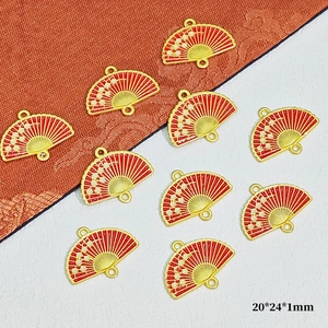 Macro detail of red plum blossom fan charms for DIY jewelry making 20x24x1mm