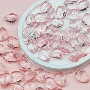 Macro view of translucent pink faceted glass beads for DIY jewelry making and accessories