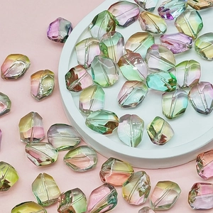 Macro shot of faceted rainbow gradient glass beads for DIY jewelry making and crafts