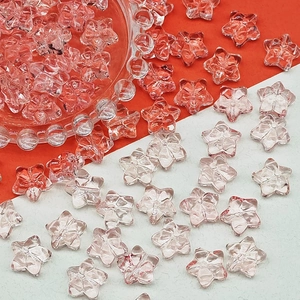 Detail of light pink star-shaped glass beads for DIY jewelry and handmade accessories