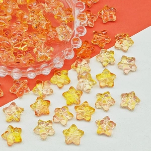 Macro detail of faceted yellow star-shaped glass beads for handmade jewelry DIY projects