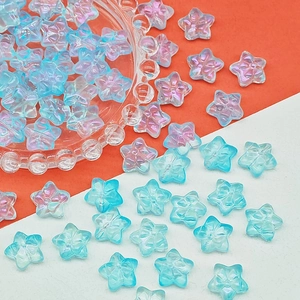 Detailed macro view of iridescent star-shaped resin beads for DIY jewelry making