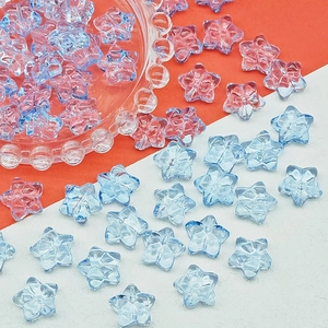 Macro view of blue and pink faceted glass star beads for DIY jewelry making