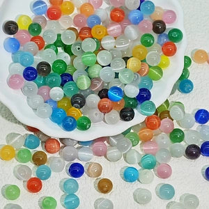 Colorful 6-10mm cat eye glass beads for DIY jewelry making in a white petal bowl