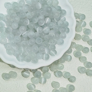 Macro shot of 6-10mm translucent grey cat-eye beads for DIY jewelry making