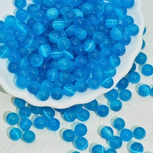 Macro shot of blue cat eye stone glass round beads for DIY jewelry making