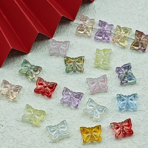 Macro detail of colorful butterfly glass beads for handmade jewelry DIY projects