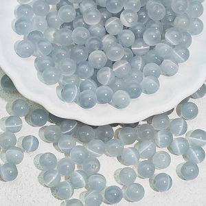 Macro shot of light blue cat eye glass beads for DIY jewelry and bracelet making