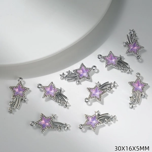 Macro detail of a purple star meteor charm with silver finish for DIY jewelry making