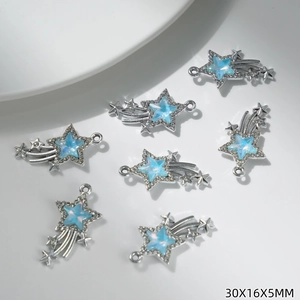 Macro detail of meteor-shaped pendants with blue opal stone and zircon meteor trail