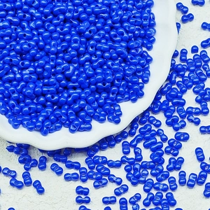 Close-up of royal blue twin-hole peanut glass beads for DIY jewelry making
