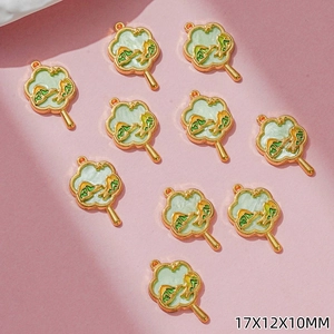 Detail of 10-piece 17x12x10mm gold fan pendants with green enamel mountain patterns