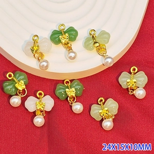 Detailed butterfly pendant charms in jade resin with pearls and gold metal hooks