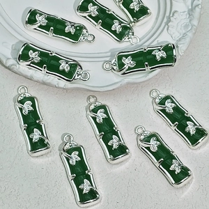 Deep green bamboo-shaped pendant with silver leaf accents for DIY jewelry making